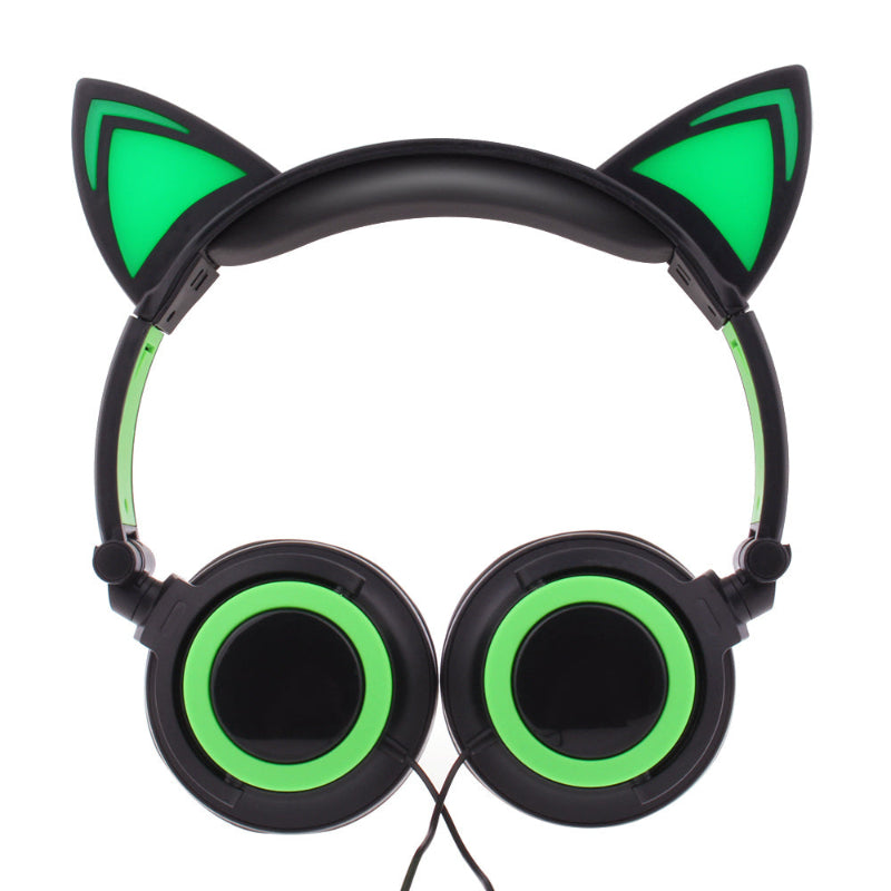 Headphones with cat ear design and green accents on a white background