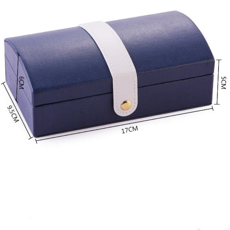 Navy blue jewelry box with white interior, showing jewelry compartments and dimensions.