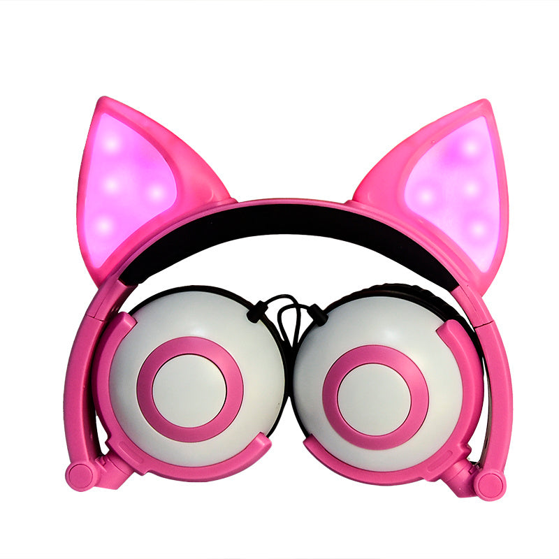 Pink headphones with cat ear design on a white background