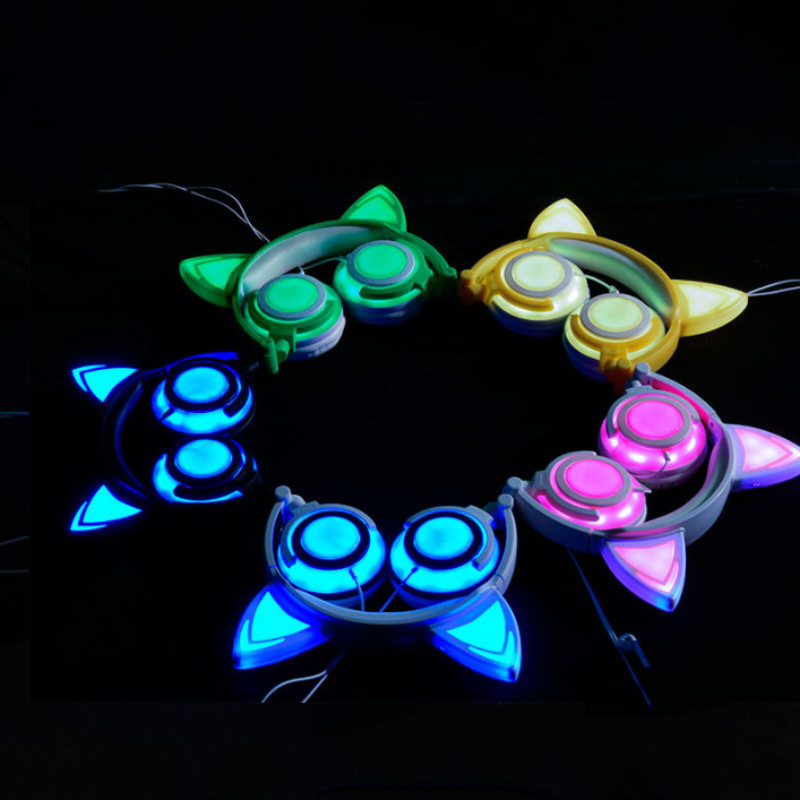 Colorful LED bracelets arranged in a circular pattern on a black background