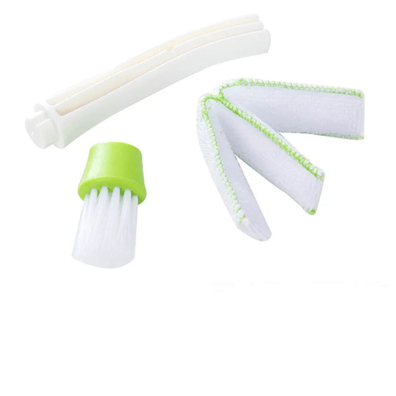 Cleaning brush set with white bristles and green handle on a white background