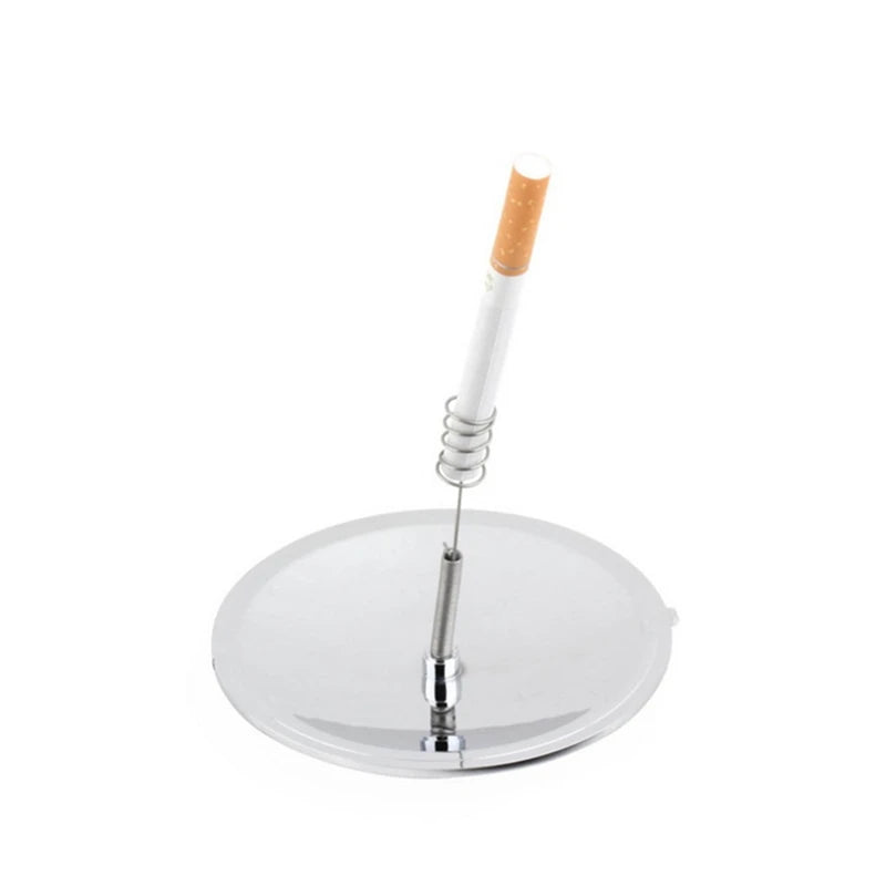 Cigarette on a metal stand against a white background
