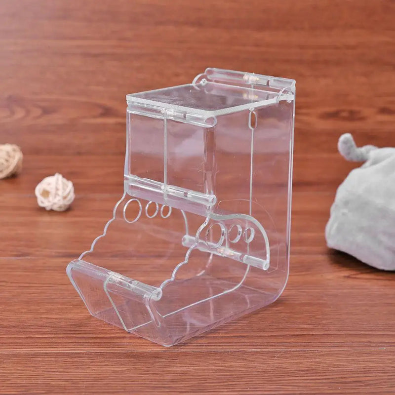 Clear plastic stand on a wooden surface with small decorative items.