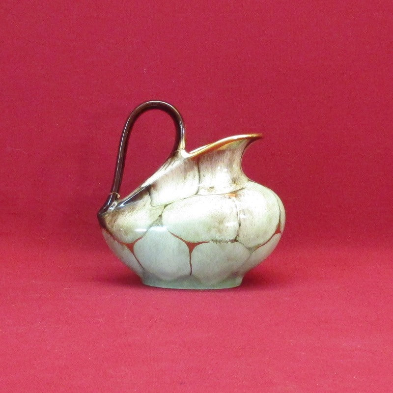 Timeless Beauty Exploring Collectible Handmade Creamers and Vintage Pottery