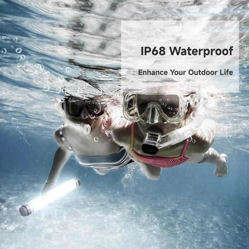 Two people underwater wearing snorkels with a flashlight, promoting IP68 waterproof technology.