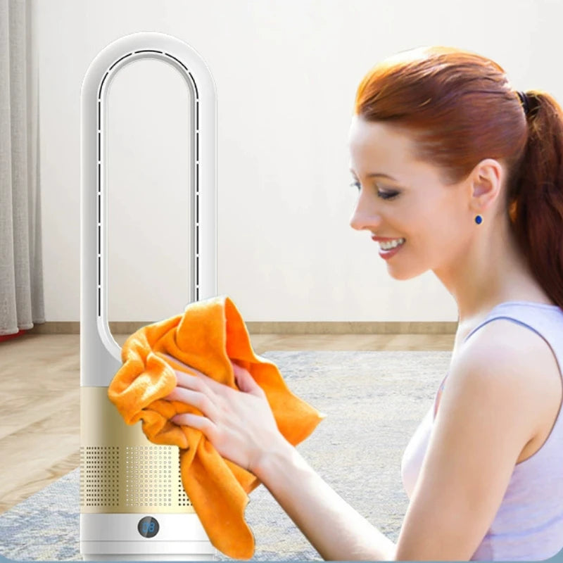 Woman cleaning a portable air conditioner with an orange cloth indoors.
