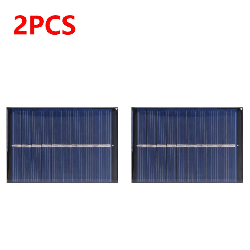 Two solar panels with '2PCS' text in red above them on a white background.