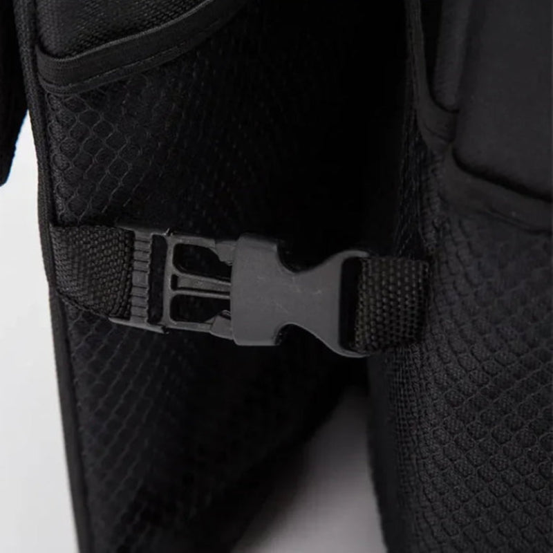 Close-up of a black boot with a buckle on a white background