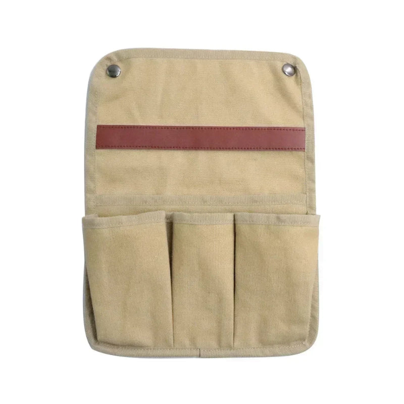 Beige tool pouch with multiple pockets and a red strip on a white background