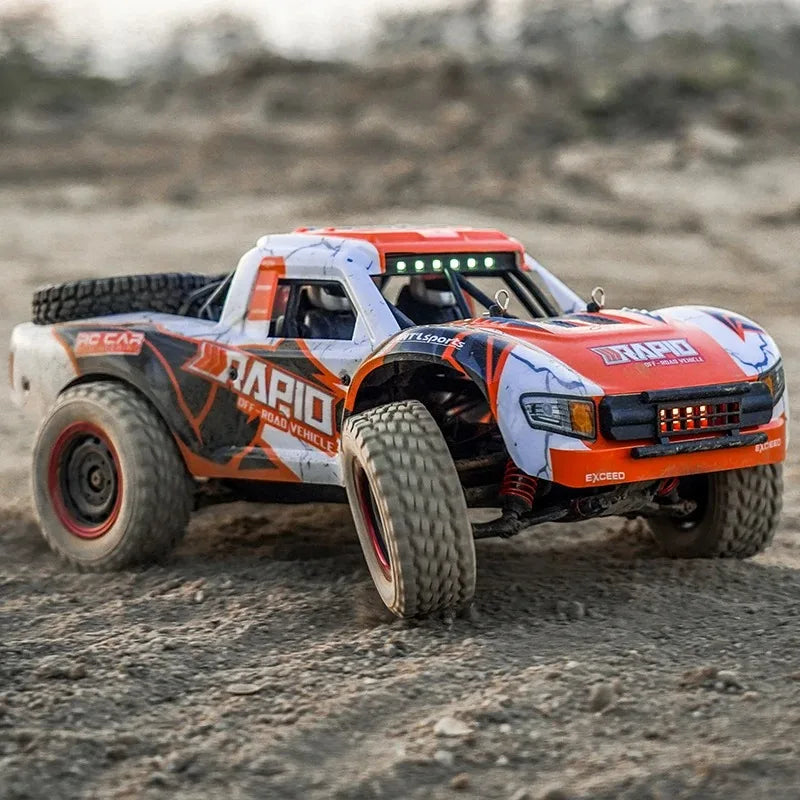 Remote-controlled model truck on a dirt surface