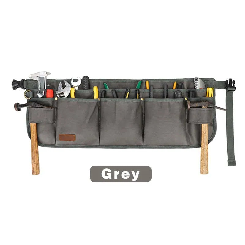 Gray tool belt with various tools on a white background