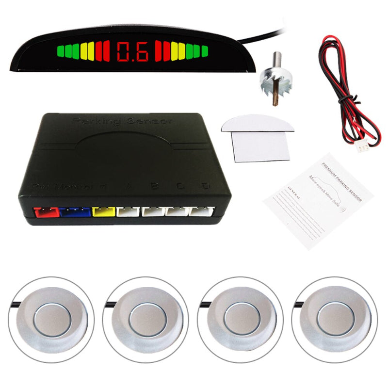 Car parking sensor kit with display, probes, and cables on a white background
