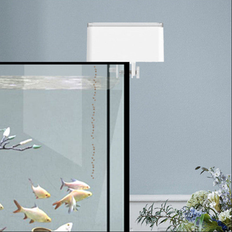 Fish tank with fish, a lamp, and decorative elements on a light blue background