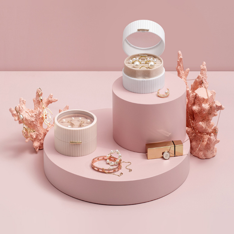 Jewelry set with pink coral decorations on a pink platform