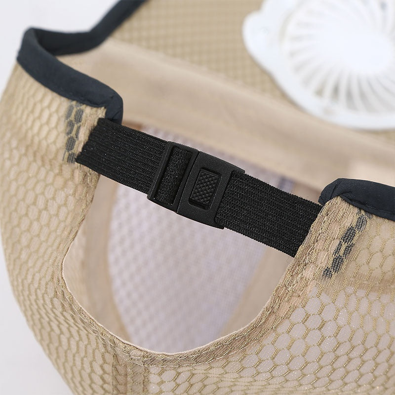 Close-up of a beige mesh cap with a black adjustable strap on a white background
