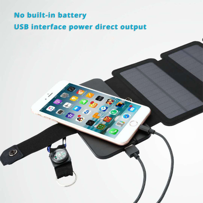 Solar panel charging a smartphone with a USB cable on a white background