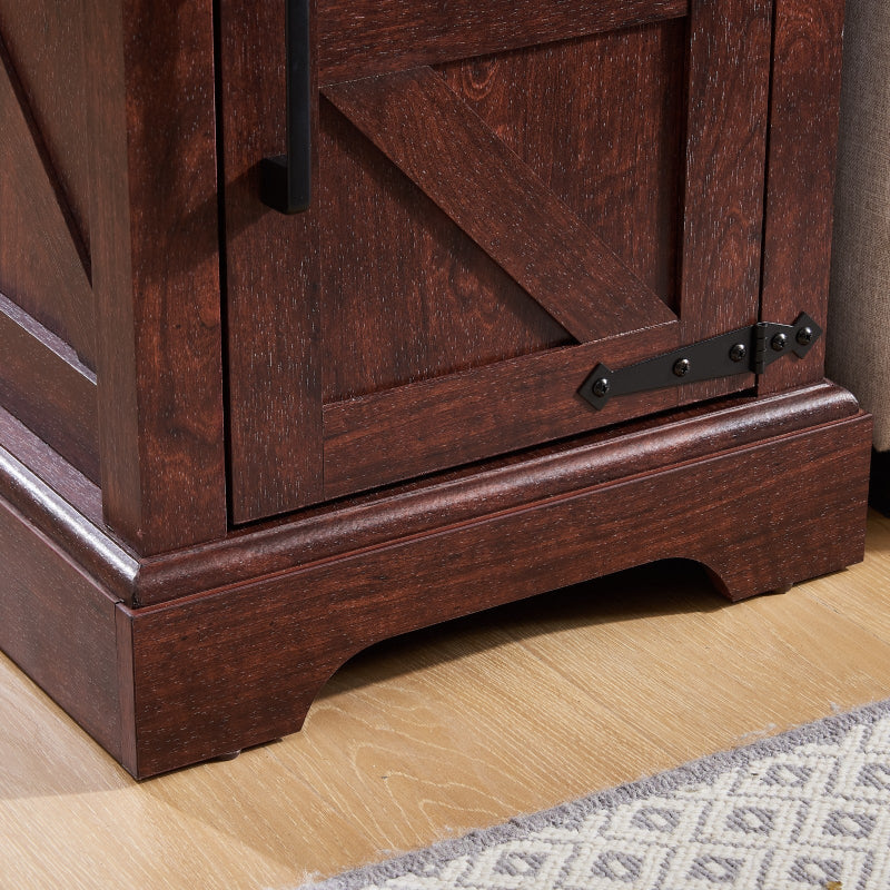 Close-up of a wooden cabinet with a door and visible hinge on a wooden floor.