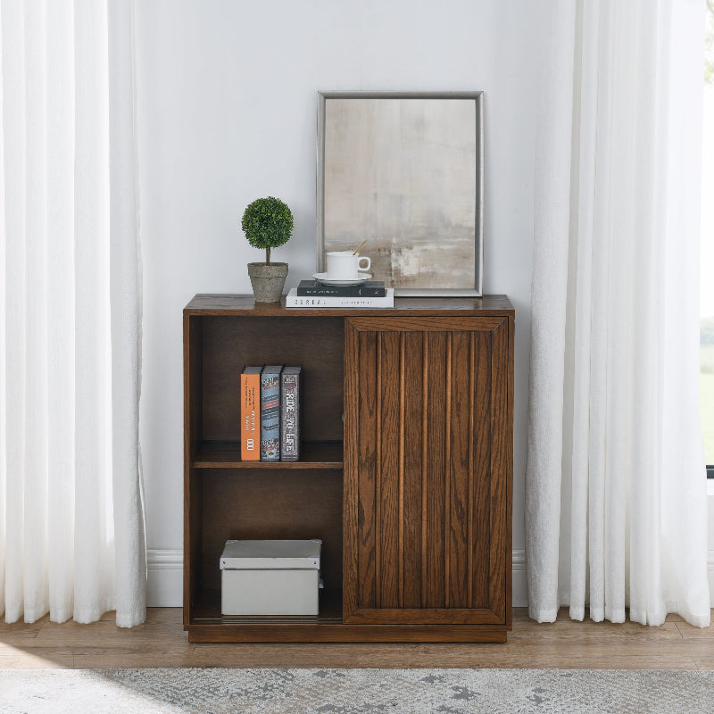 Wooden bookshelf with decorative items against a white wall