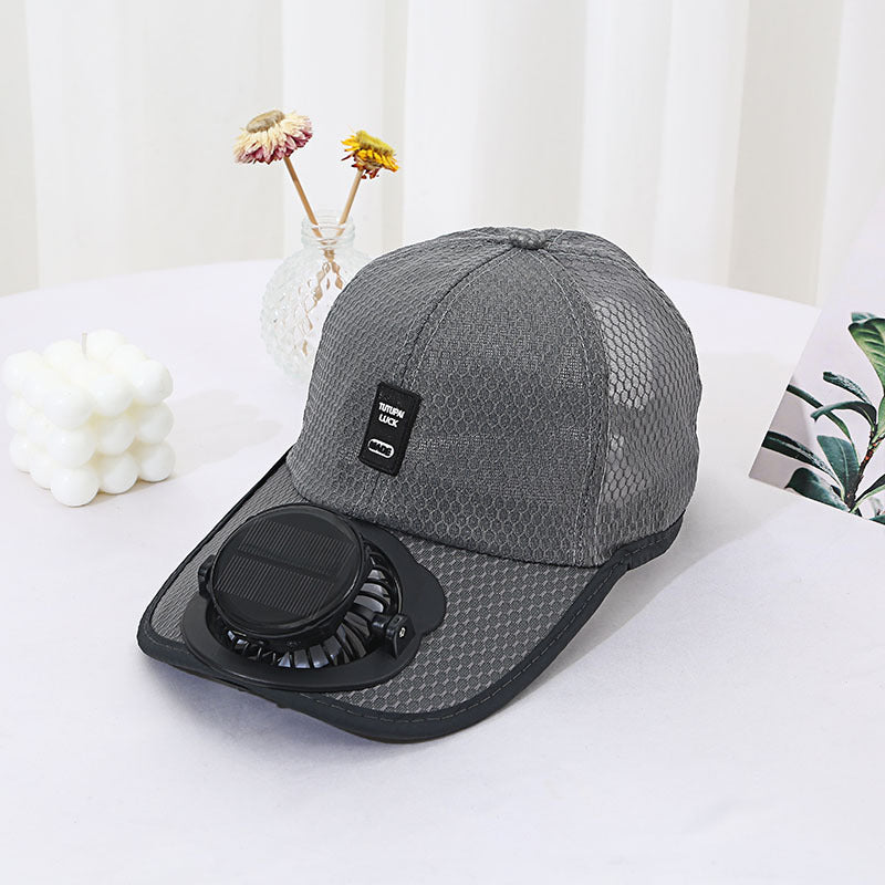 Gray cap with a built-in fan on a white surface