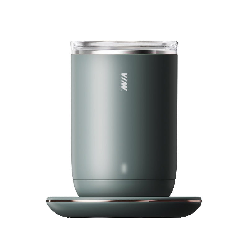 Gray tumbler with a charging pad on a white background