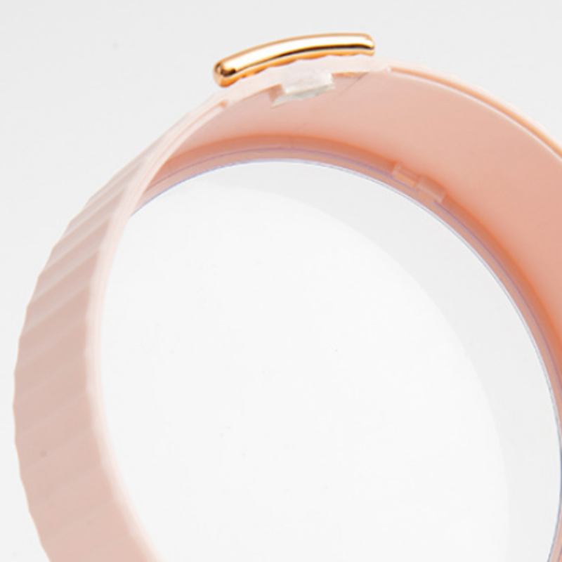 Rose gold bracelet on a light gray background
