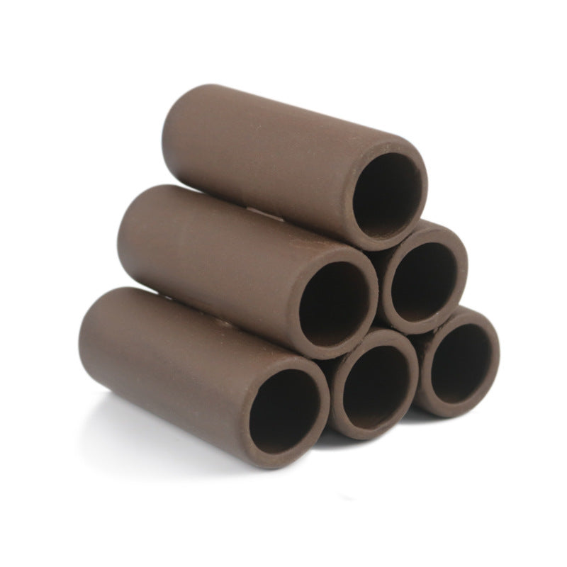 Stack of brown cylindrical objects on a white background