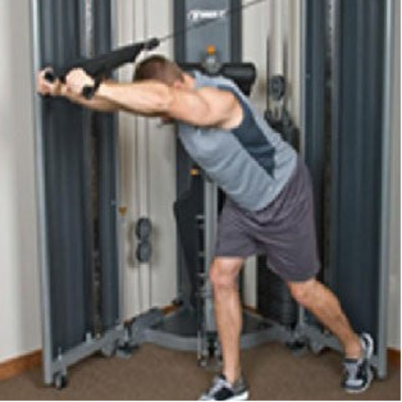 Person exercising on a cable machine in a gym setting