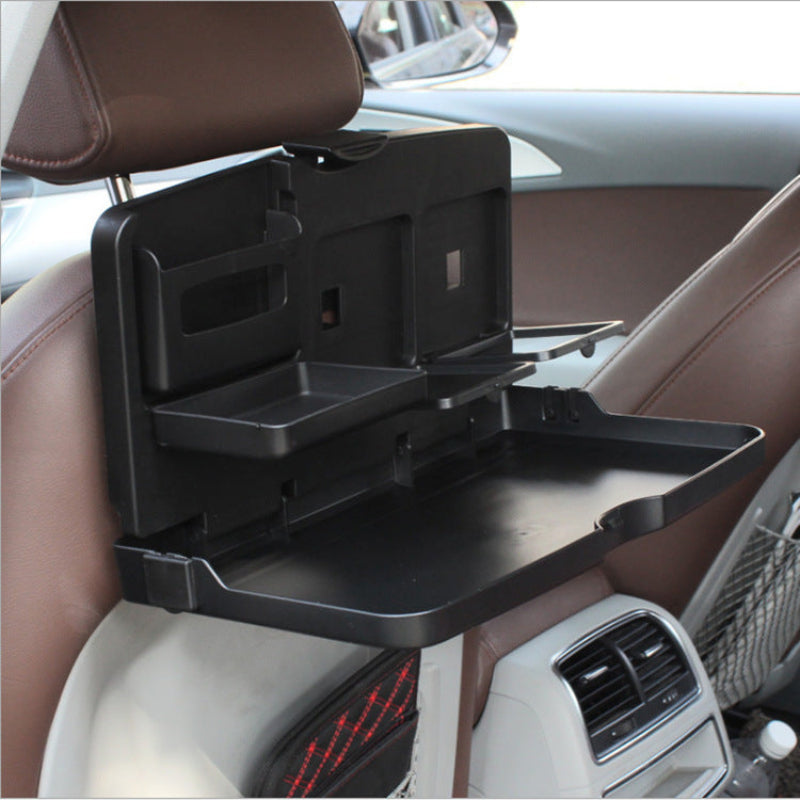 Car-mounted tray table attached to a car seat with a clear background