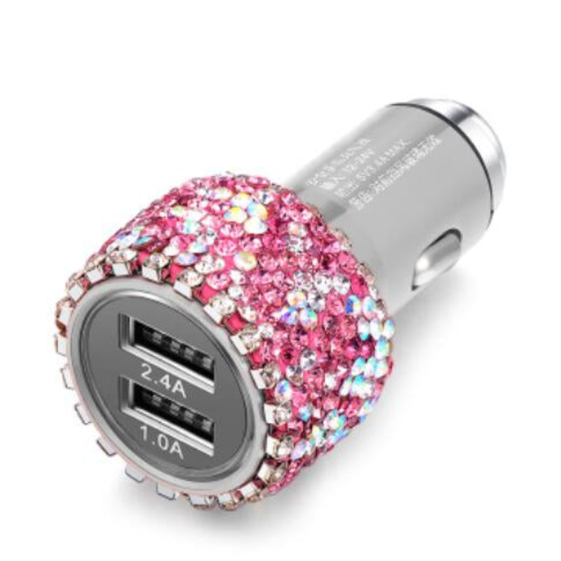 Car charger with pink gemstone embellishments on a white background