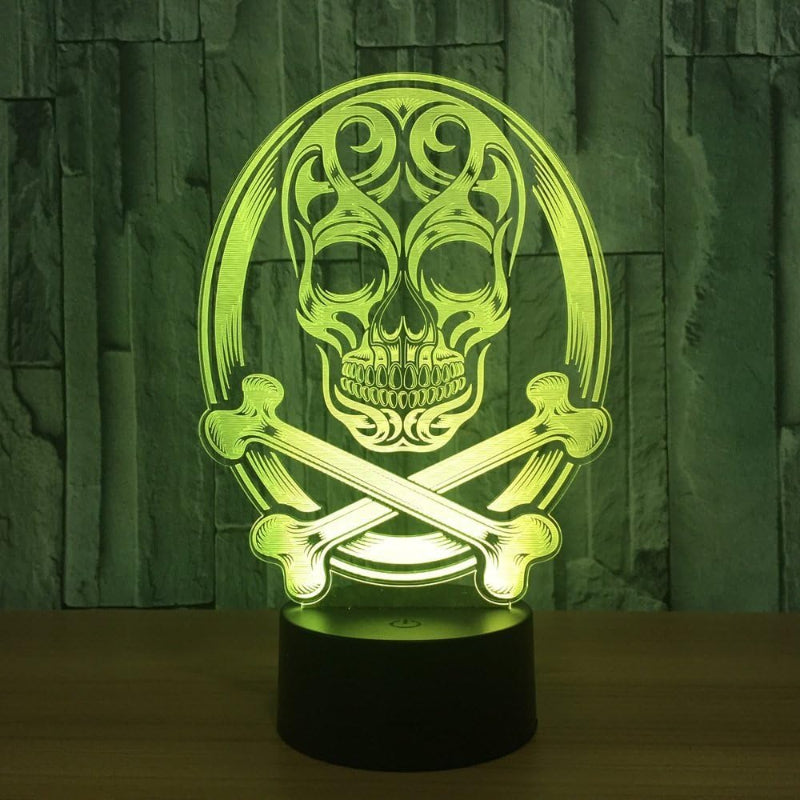 A 3D optical illusion night light featuring a glowing green skull and crossbones design on a black cylindrical base, set against a dark textured background.