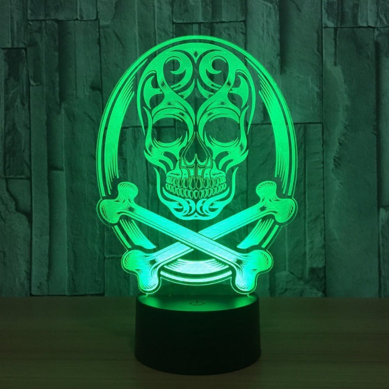A 3D optical illusion LED night light featuring a glowing green skull and crossbones design on a black cylindrical base, set against a dark textured background.