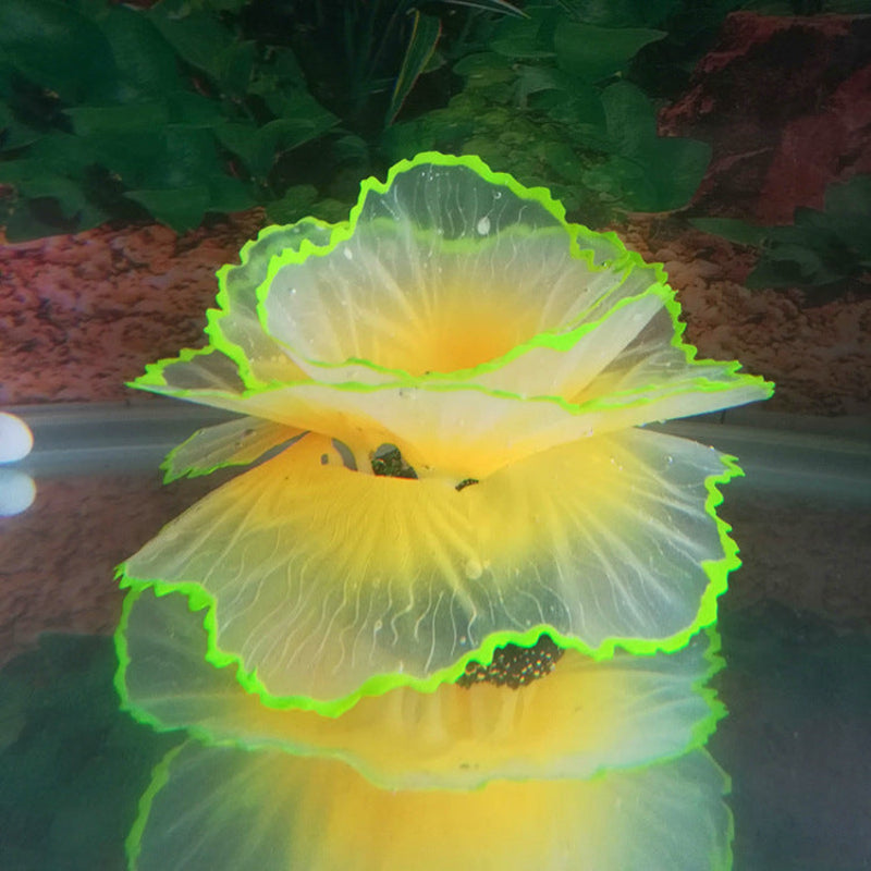Fluorescent yellow and green flower-like object in water with a natural background