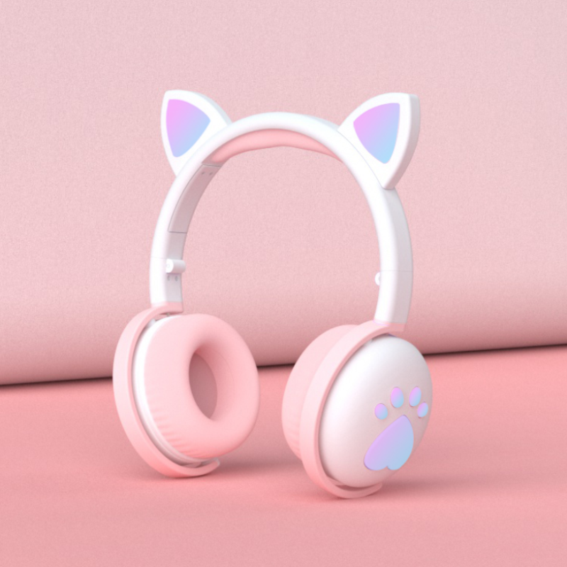 Pink and white headphones with cat ear and paw design on a pink background