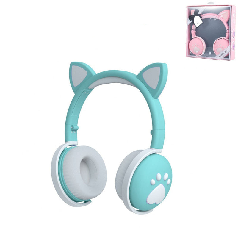 Turquoise cat ear headphones with white accents on a white background, including a package box.