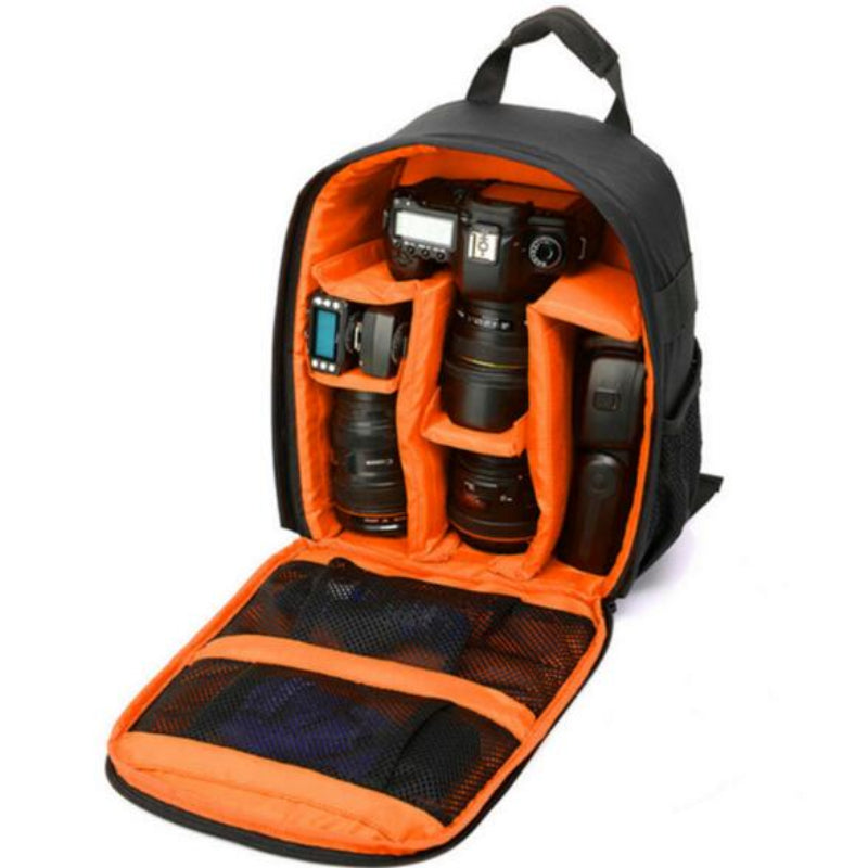 Camera backpack with orange interior compartments holding a camera and lenses on a white background