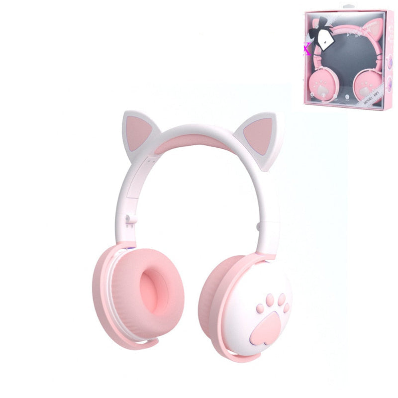 Pink headphones with cat ears and paw design on a white background, including a package box.