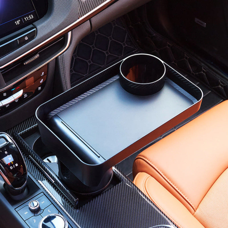 Car cup holder tray with drink cup in a modern car interior
