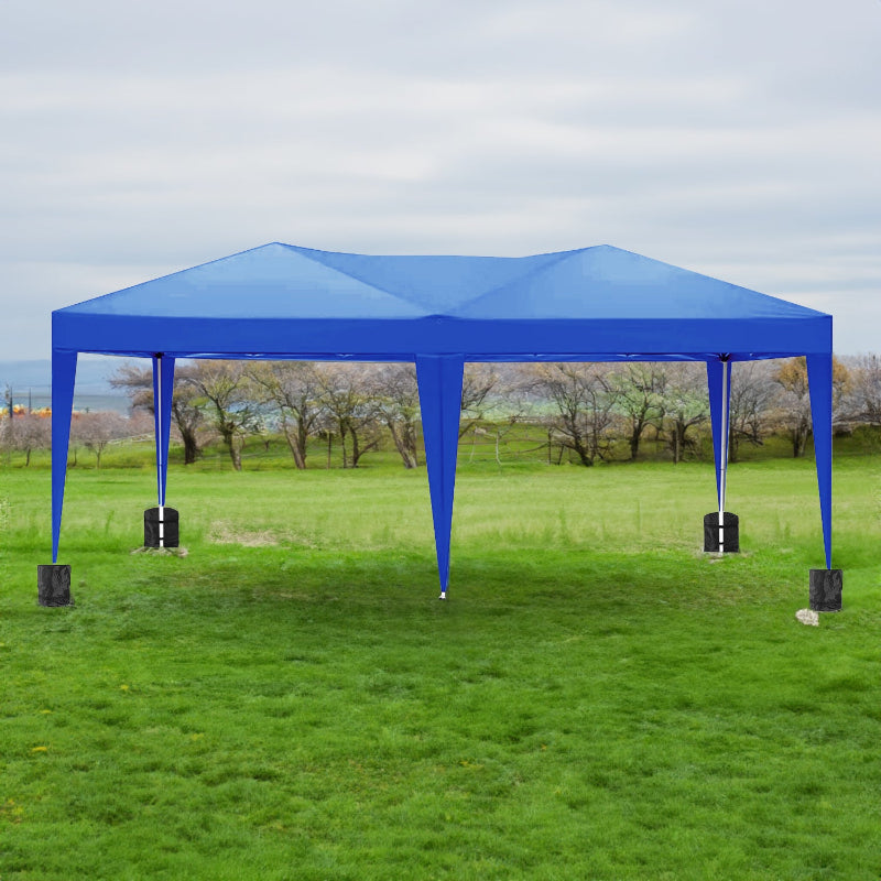 Blue outdoor canopy tent set up on a grassy field with trees in the background.