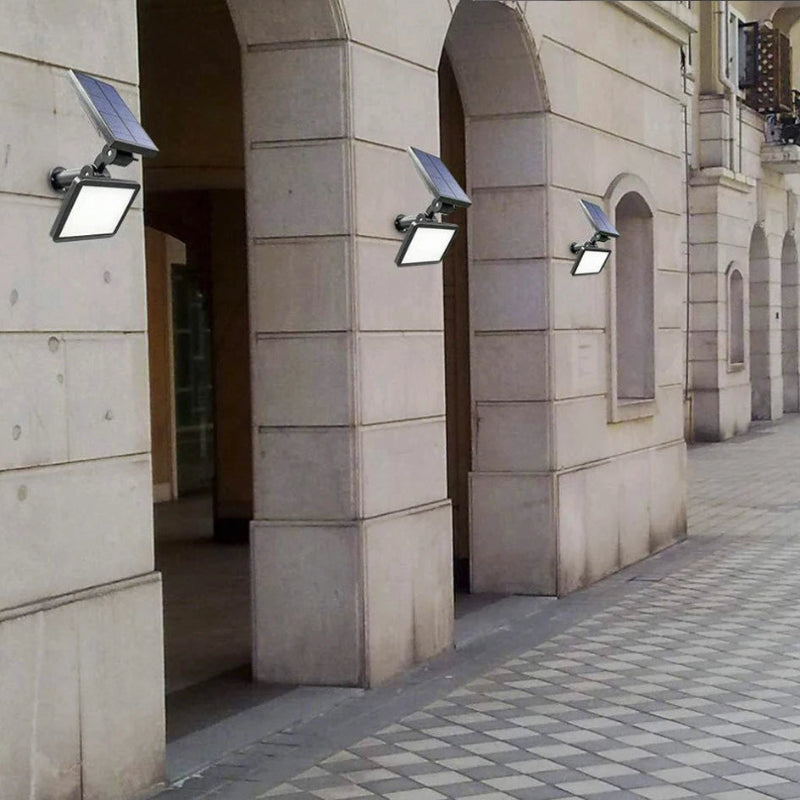 Solar lights attached to a stone building facade