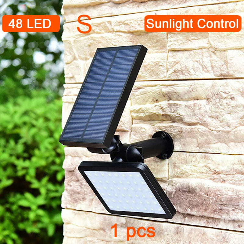 Solar-powered outdoor light fixture with 48 LEDs attached to a stone wall.