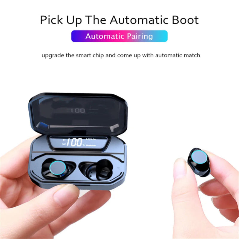 Black wireless earbuds with charging case held by a hand, on a white background.
