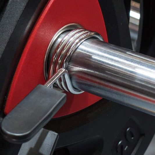 Set of metal measuring tools including weights and a tool with a keychain attachment.