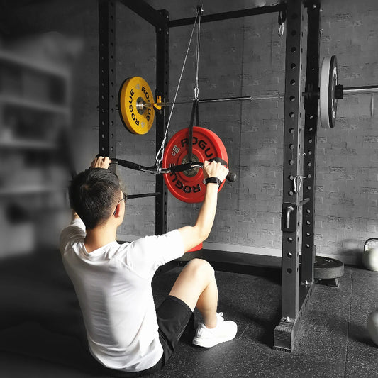 Person using a weightlifting machine in a gym setting