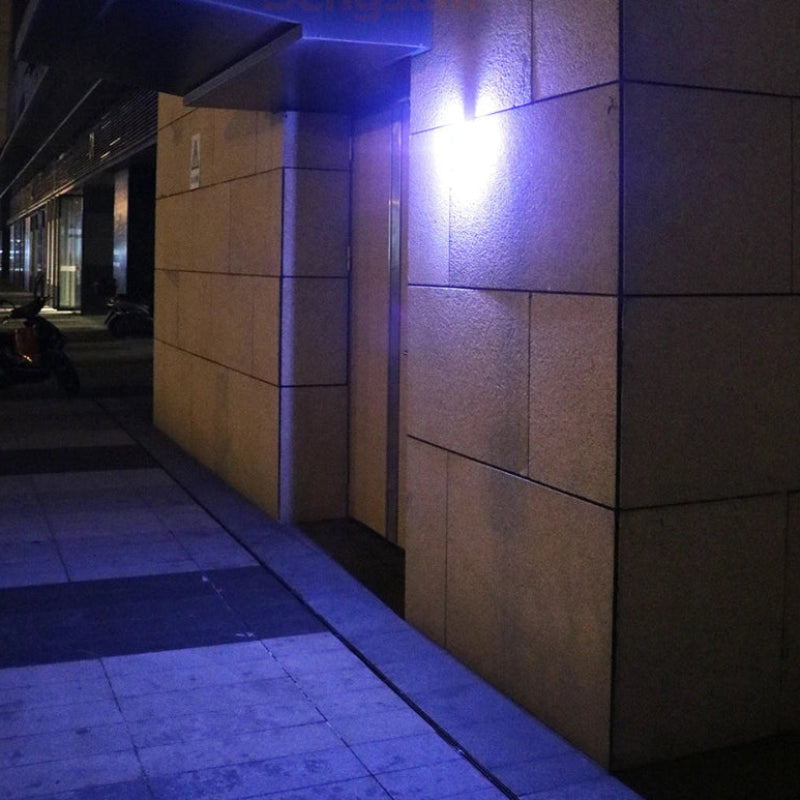 Street light on a building wall at night