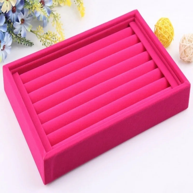 Pink jewelry box with compartments on a white background