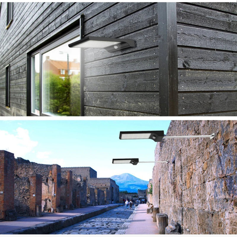 Modern outdoor wall lights on a wooden and stone building exterior.