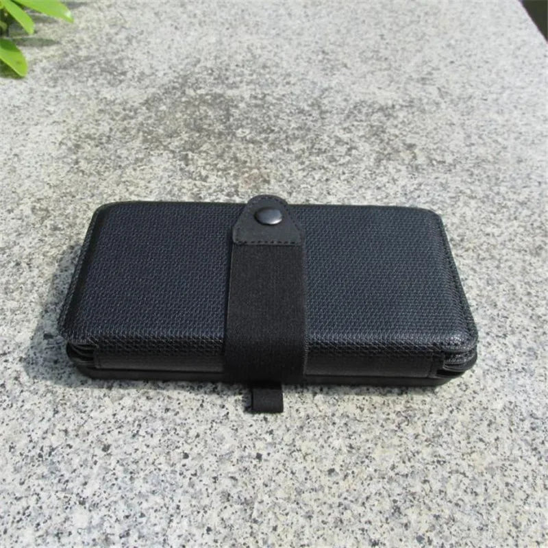 Black leather wallet on a textured surface