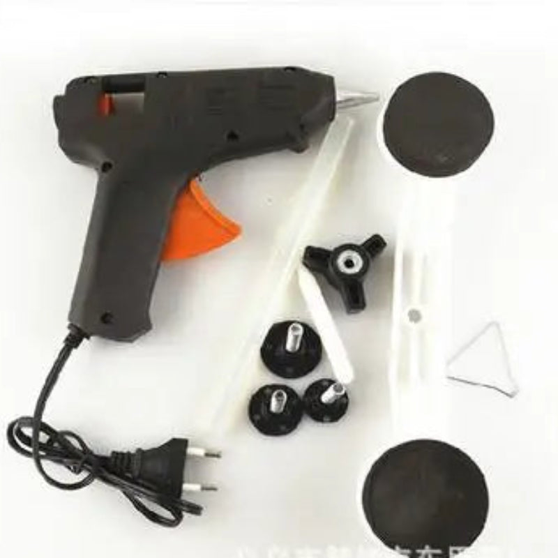 Hot glue gun with accessories on a white background