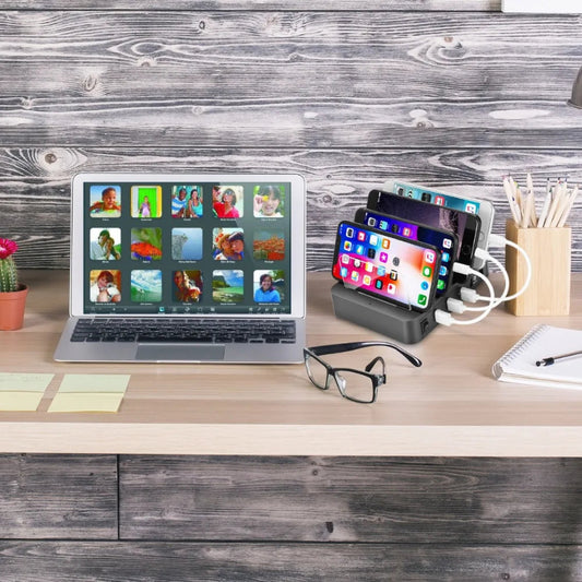Laptop, smartphone, and tablet on a desk with a wooden background
