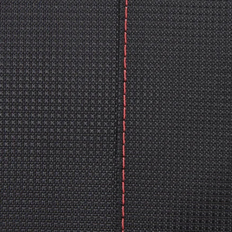 Close-up of black fabric with red stitching on a black background